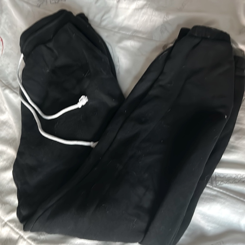 Black sweats with white draw strings